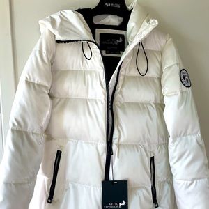 Arctic expedition  puffer. White pearlescent color. Storm cuff /thumb holes.